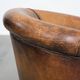 Vintage club chair in sheepskin leather with a characterful look