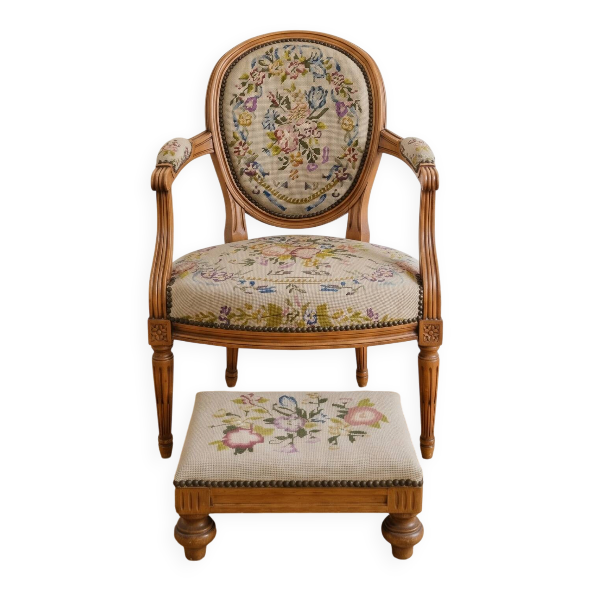 Armchair and footrest set in Louis XVI style