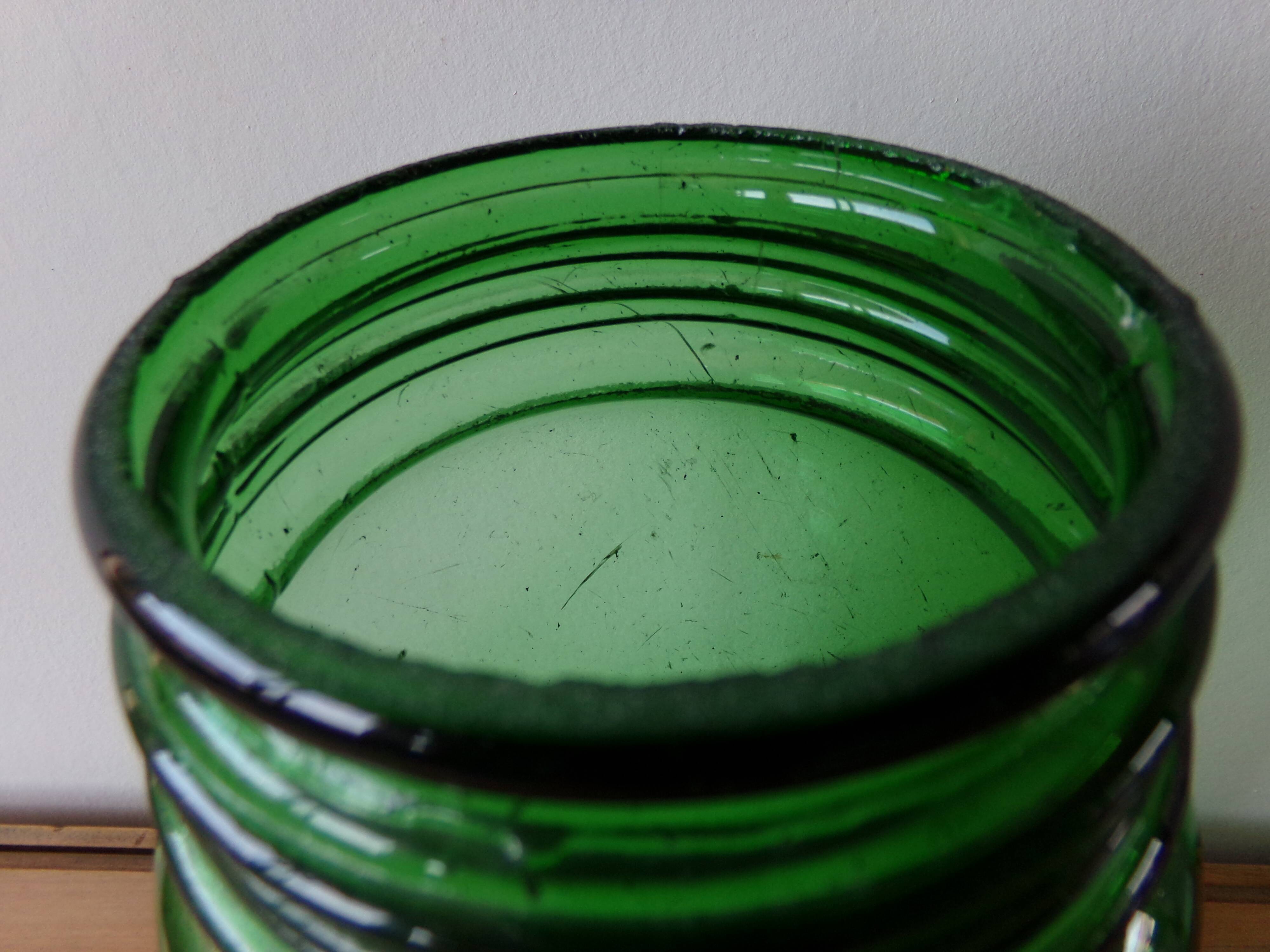 Antique green glass jar