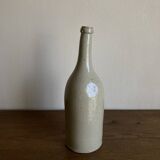 Stoneware bottle tilted at an angle, early 20th century