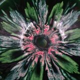 Green faience bowl decorated with multicolored drips around 1970