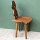 Old Swiss escabelle chair in carved wood