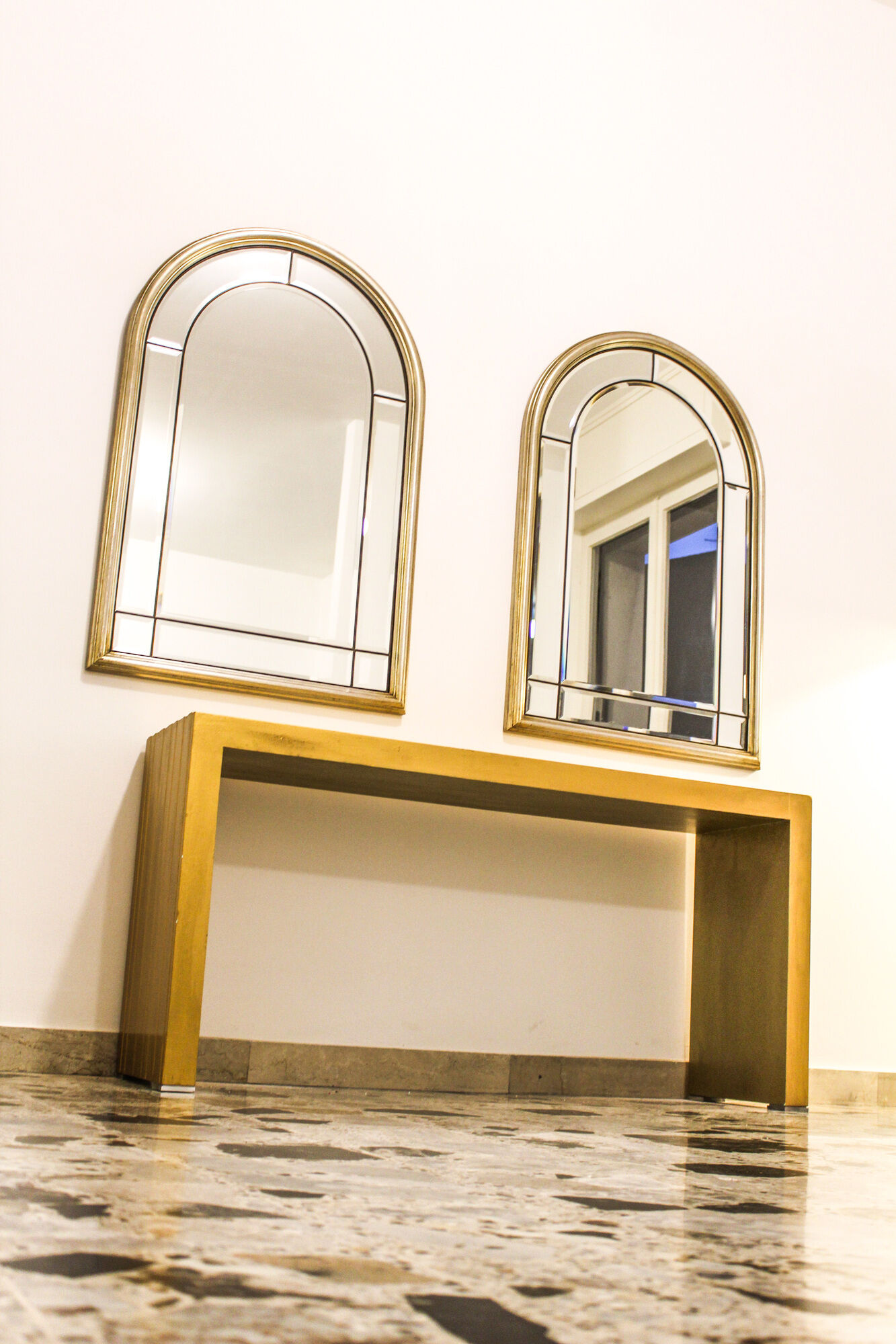 Pair of bevelled mirrors, brass edging frame in brushed wood years Italy 70's