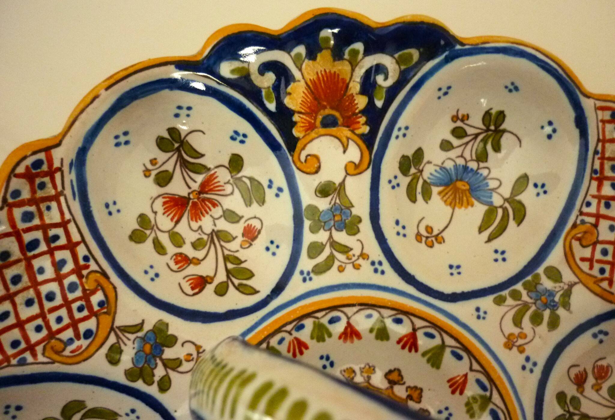 Dish, egg server in hand-painted earthenware, signed Geo Martel