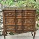 Carved and moulded solid wood commode in the Louis XV style.