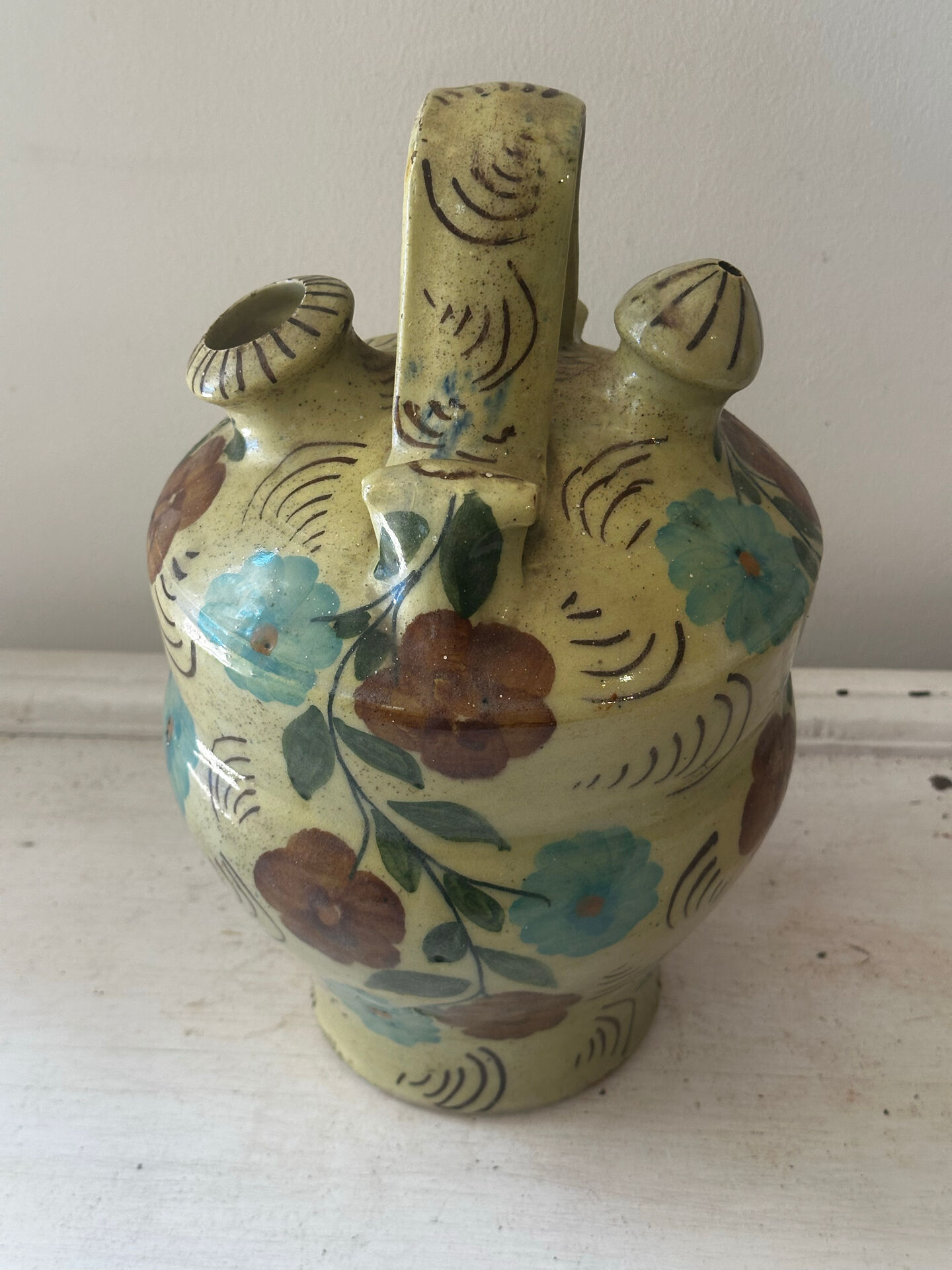 Mediterranean ceramic jug with floral decoration.