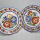 Pair of Henriot Quimper plates decorated with flower, 24 cm