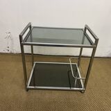 1970s coffee table in brass with a double smoked glass top.