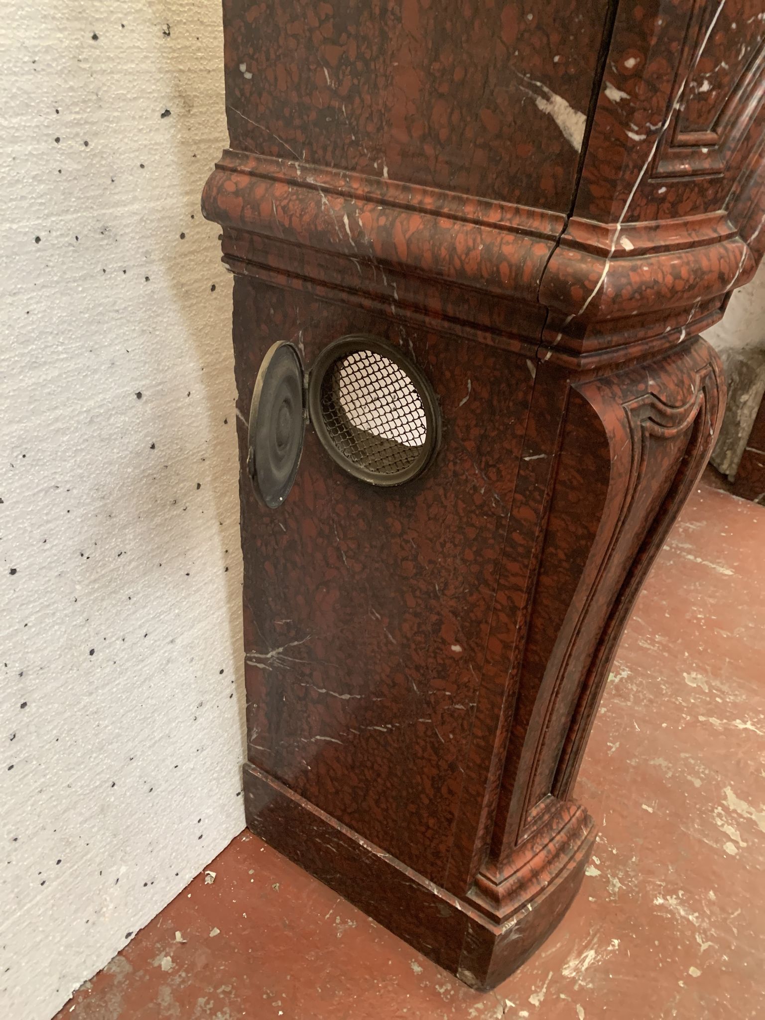 Pair of Louis XIV style fireplaces in red cherry marble. XIX century.