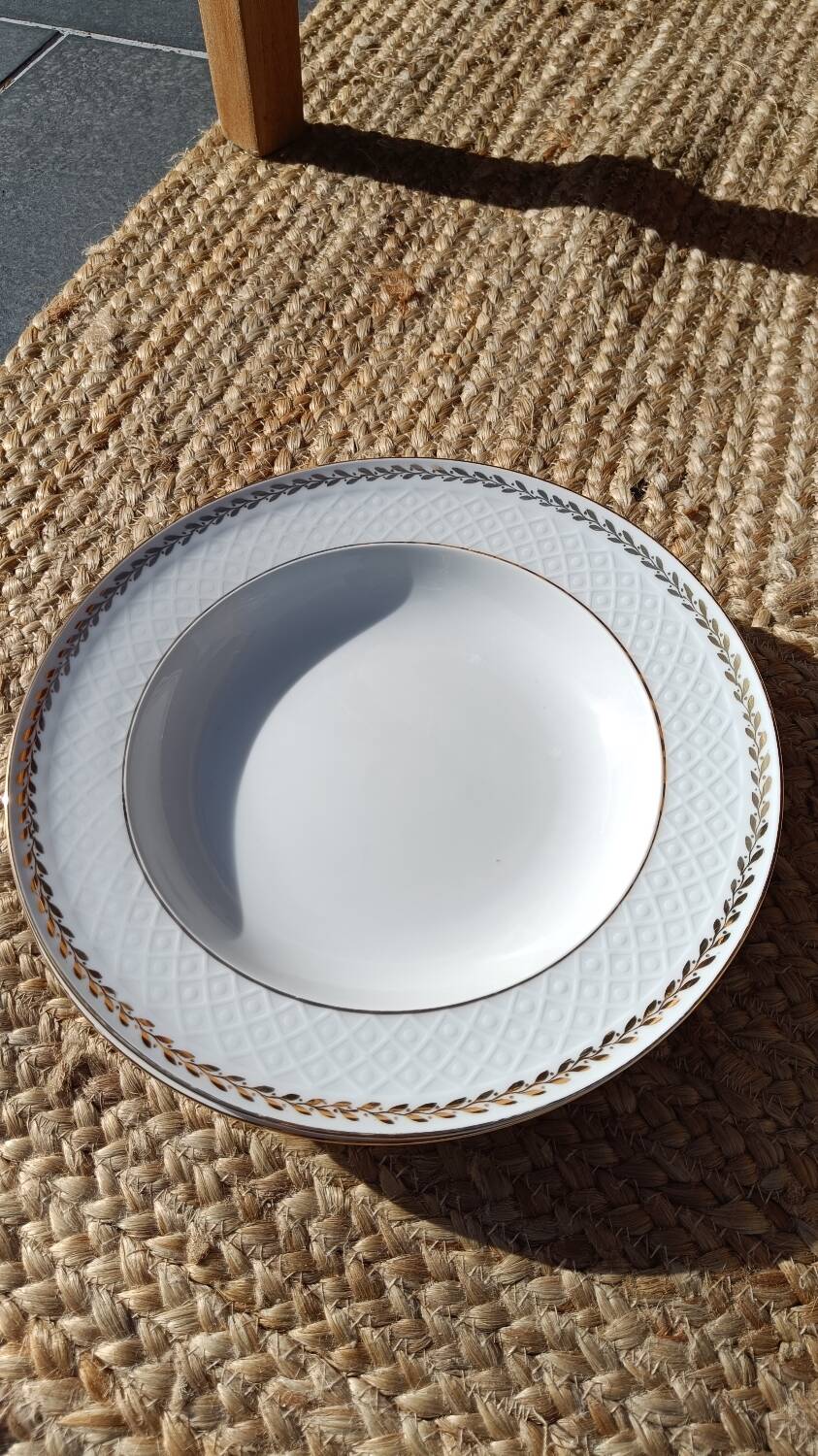 Twelve white porcelain plates