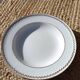 Twelve white porcelain plates