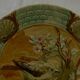 Slop bowl with bird decoration.