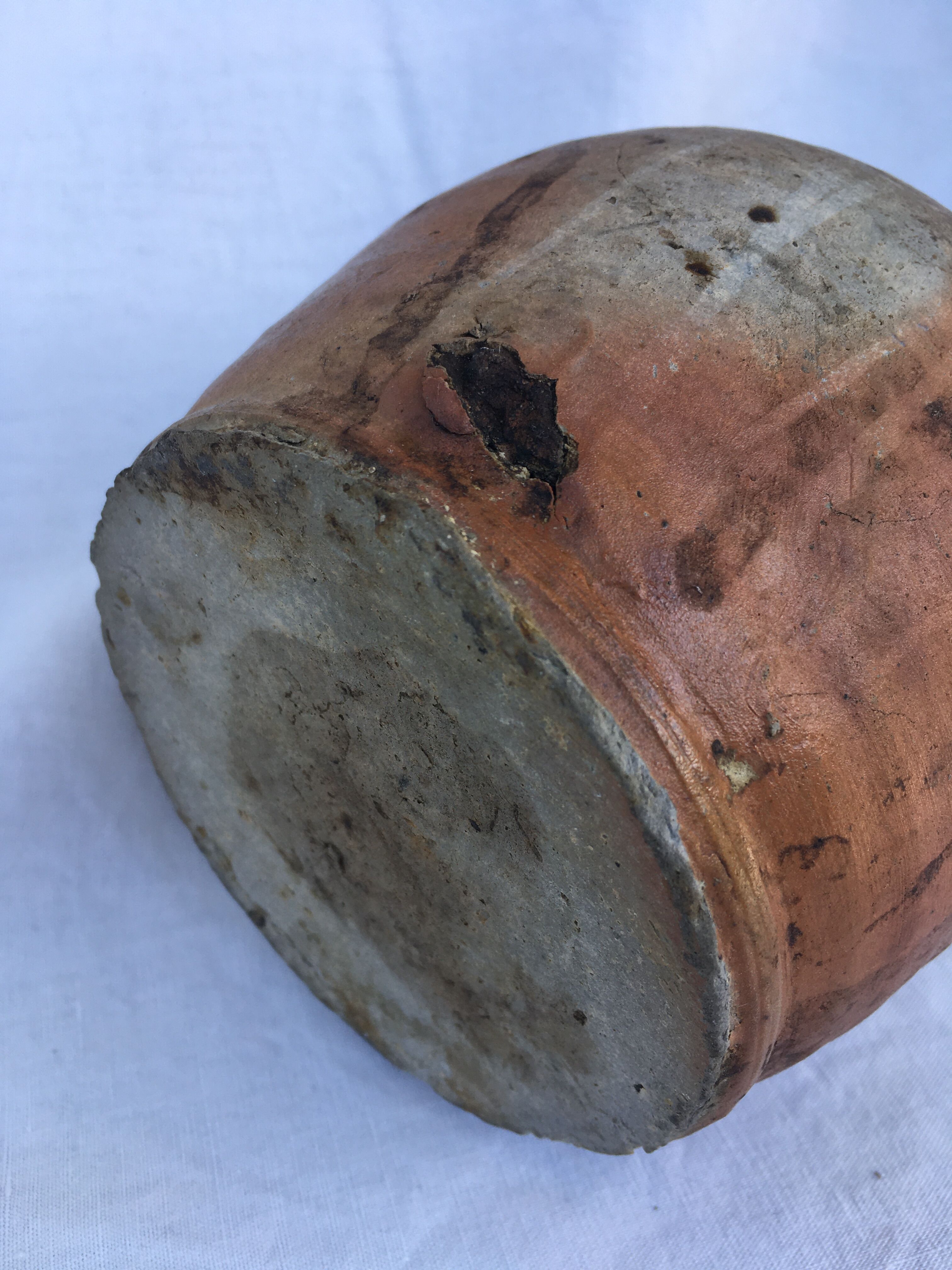 Ancient jug in glazed sandstone