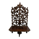 Carved wooden wall shelf