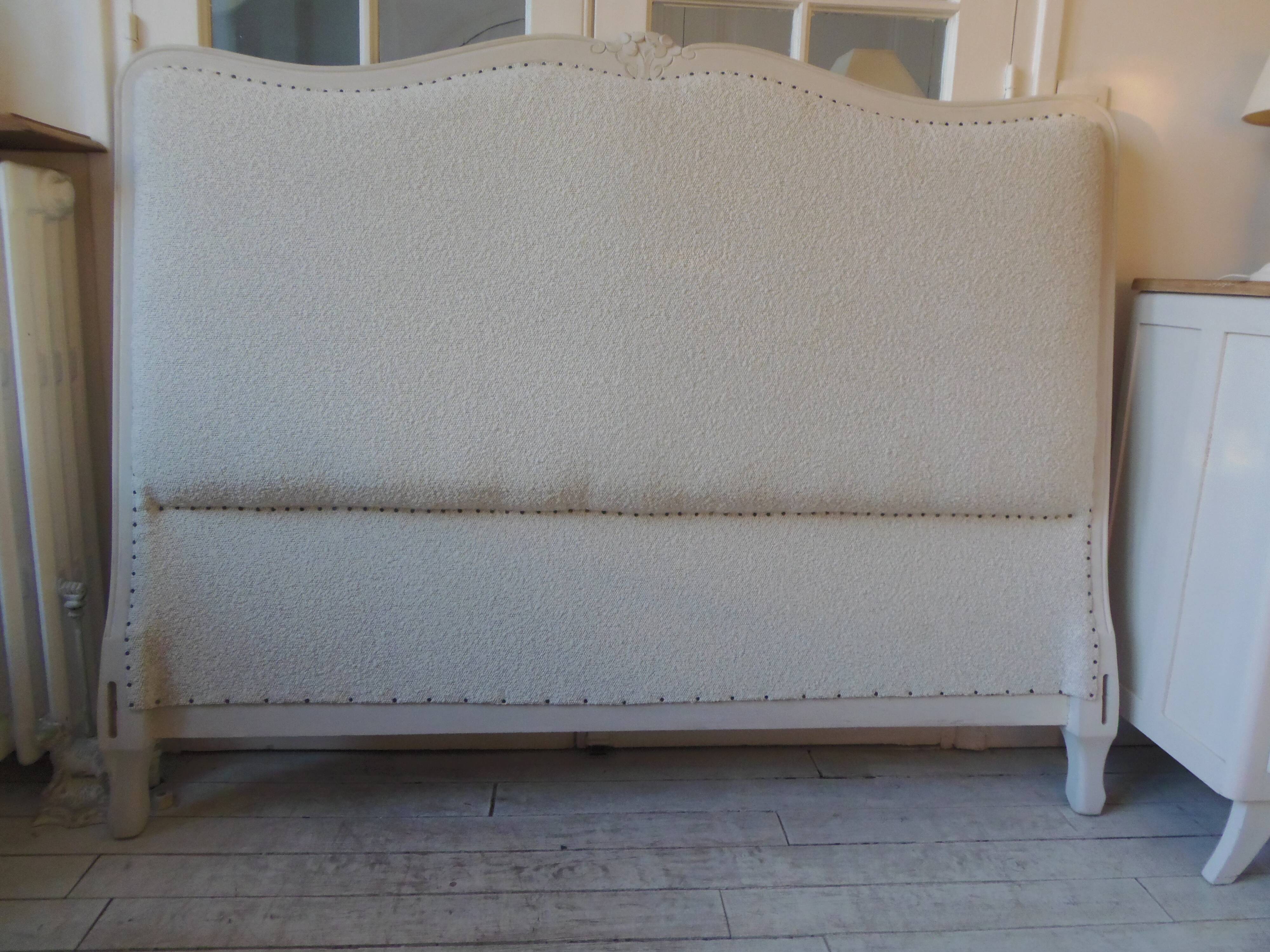 Louis XV style headboard with pearl grey patina, upholstered in off-white bouclette.