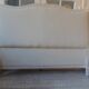 Louis XV style headboard with pearl grey patina, upholstered in off-white bouclette.