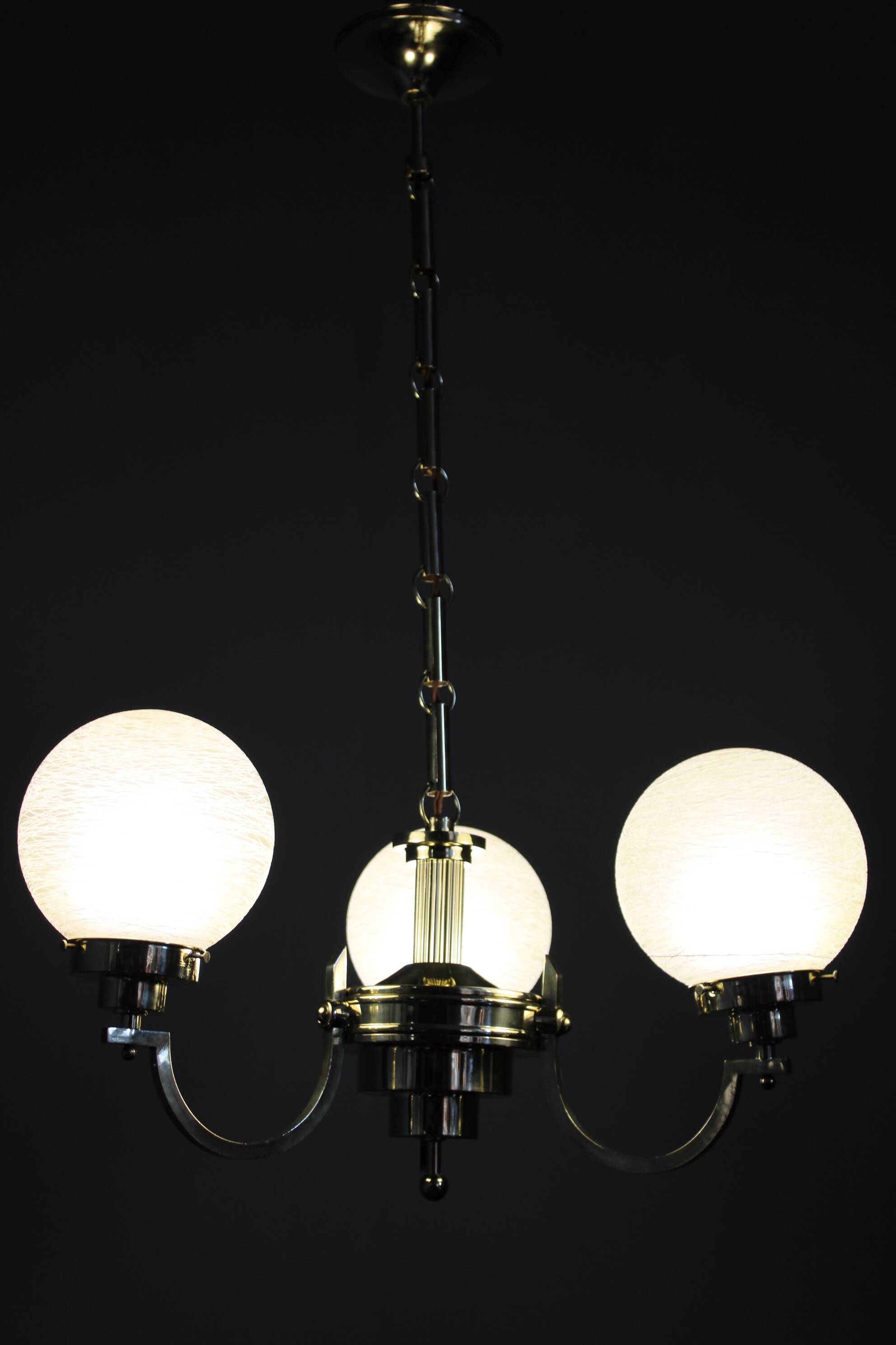 1930s Art Deco brass chandelier with textured glass globes, Czechoslovakia