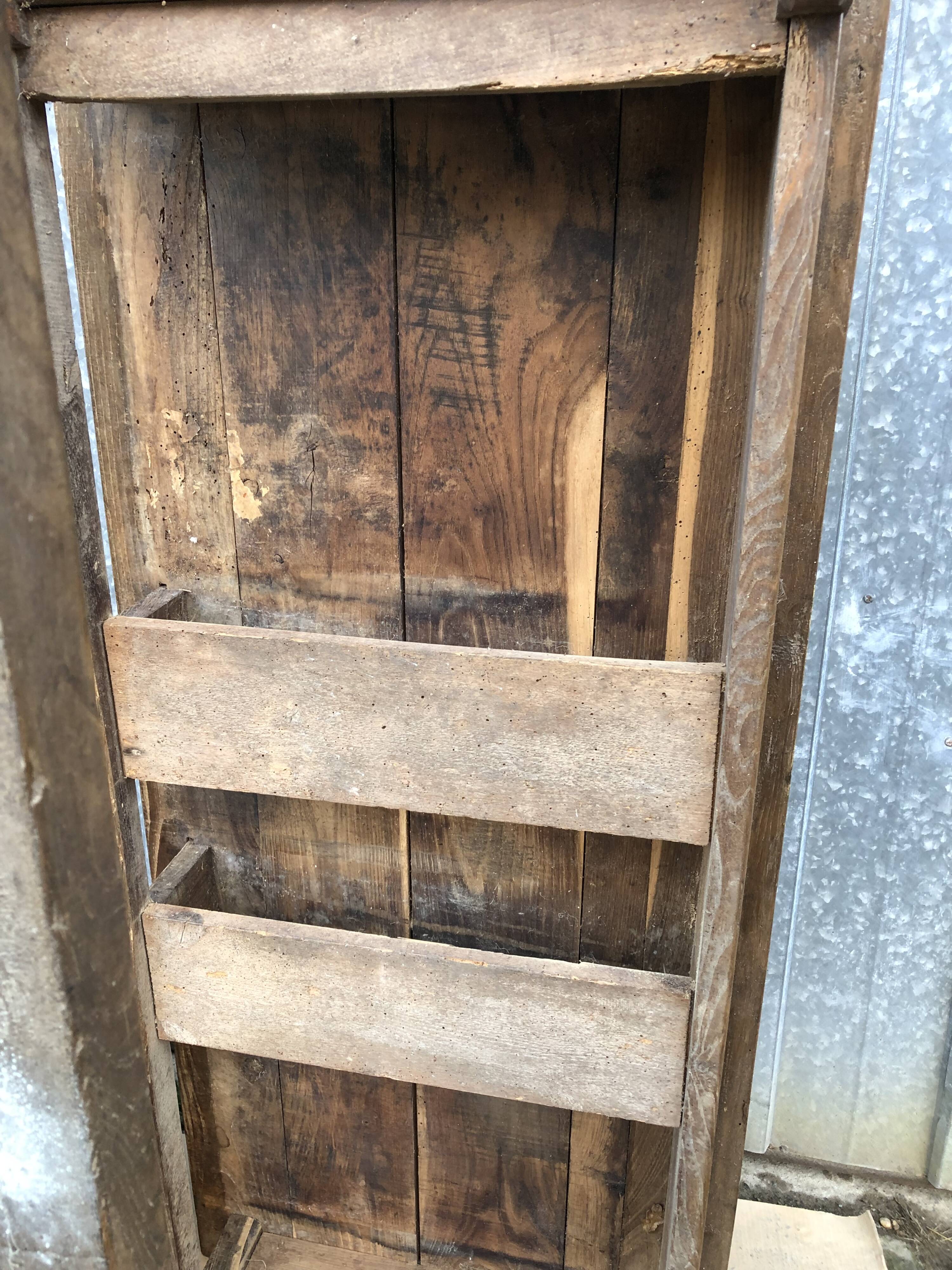 Old chestnut table with 3 front drawers and a cat bar.