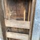 Old chestnut table with 3 front drawers and a cat bar.