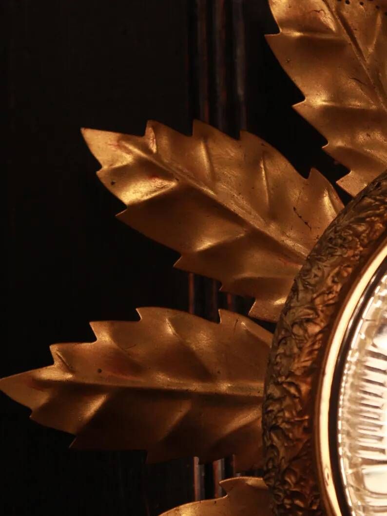 Gold metal wall sconce with cut glass in Hollywood Regency style from the 1960s.
