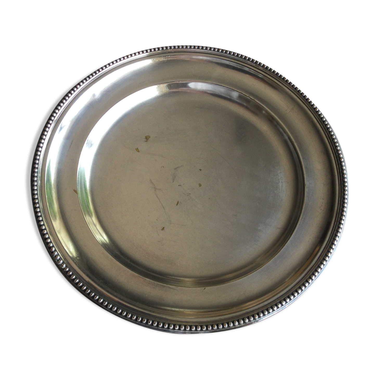 round plate in punched silver metal