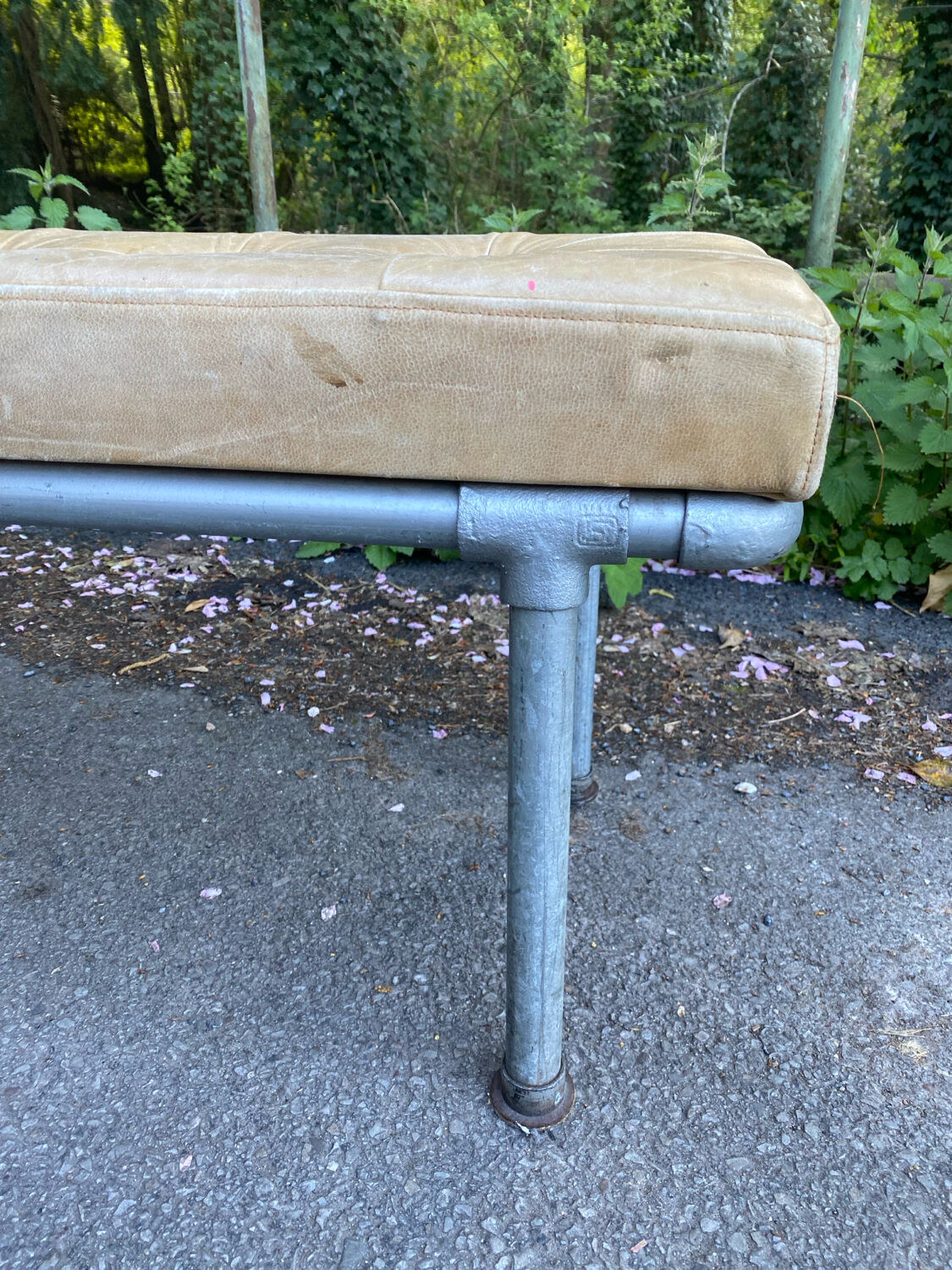 Vintage Italian industrial bench in leather and metal.