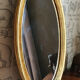 Oval mirror in gilded wood 67X52