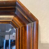 Beveled mirror in its wooden frame