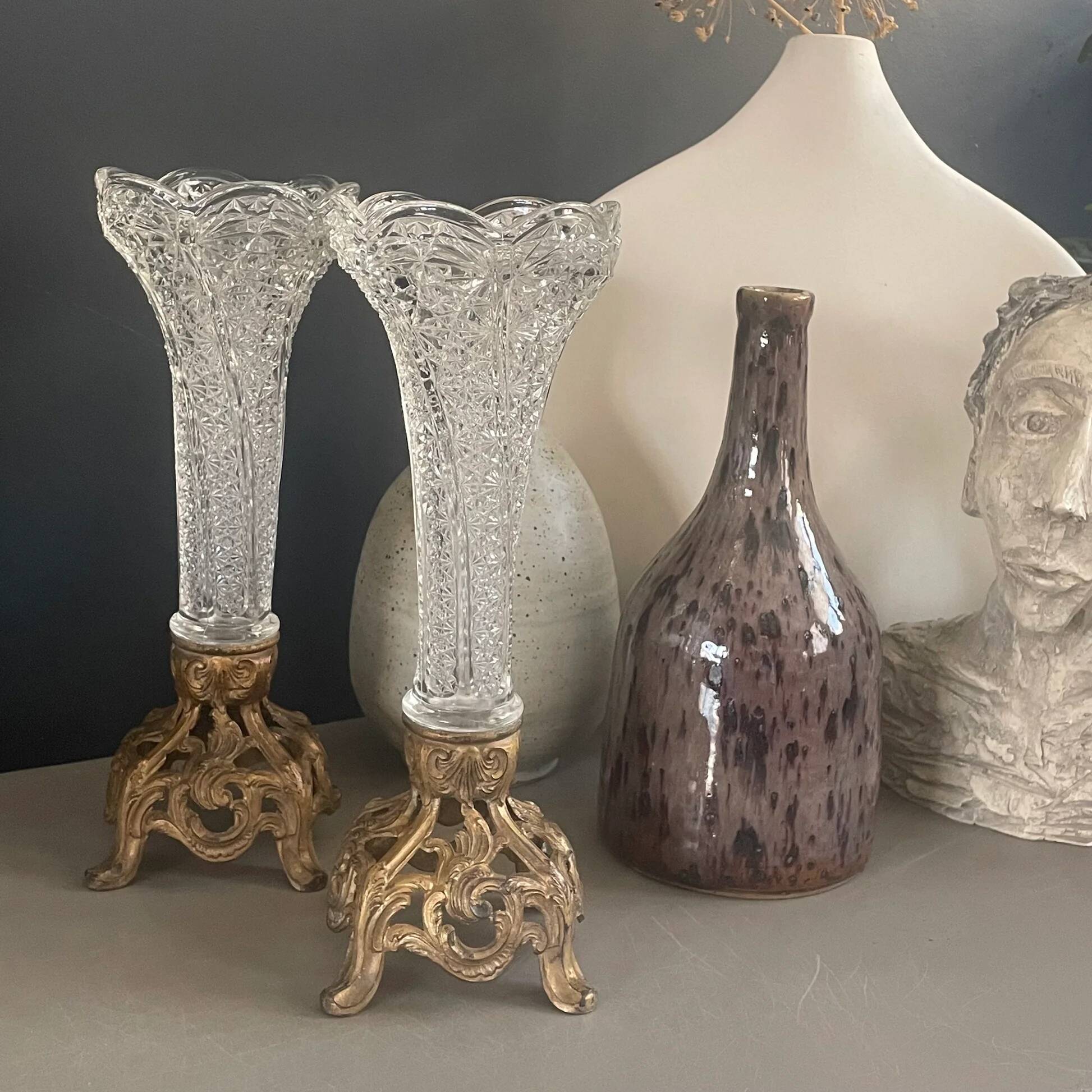 Pair of candlesticks in spelter and moulded glass