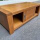 Solid wood coffee table with sliding door, stained pine, 120x60cm.