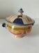 Antique bonbonnière Quimper with pink basket decoration and Breton portrait.