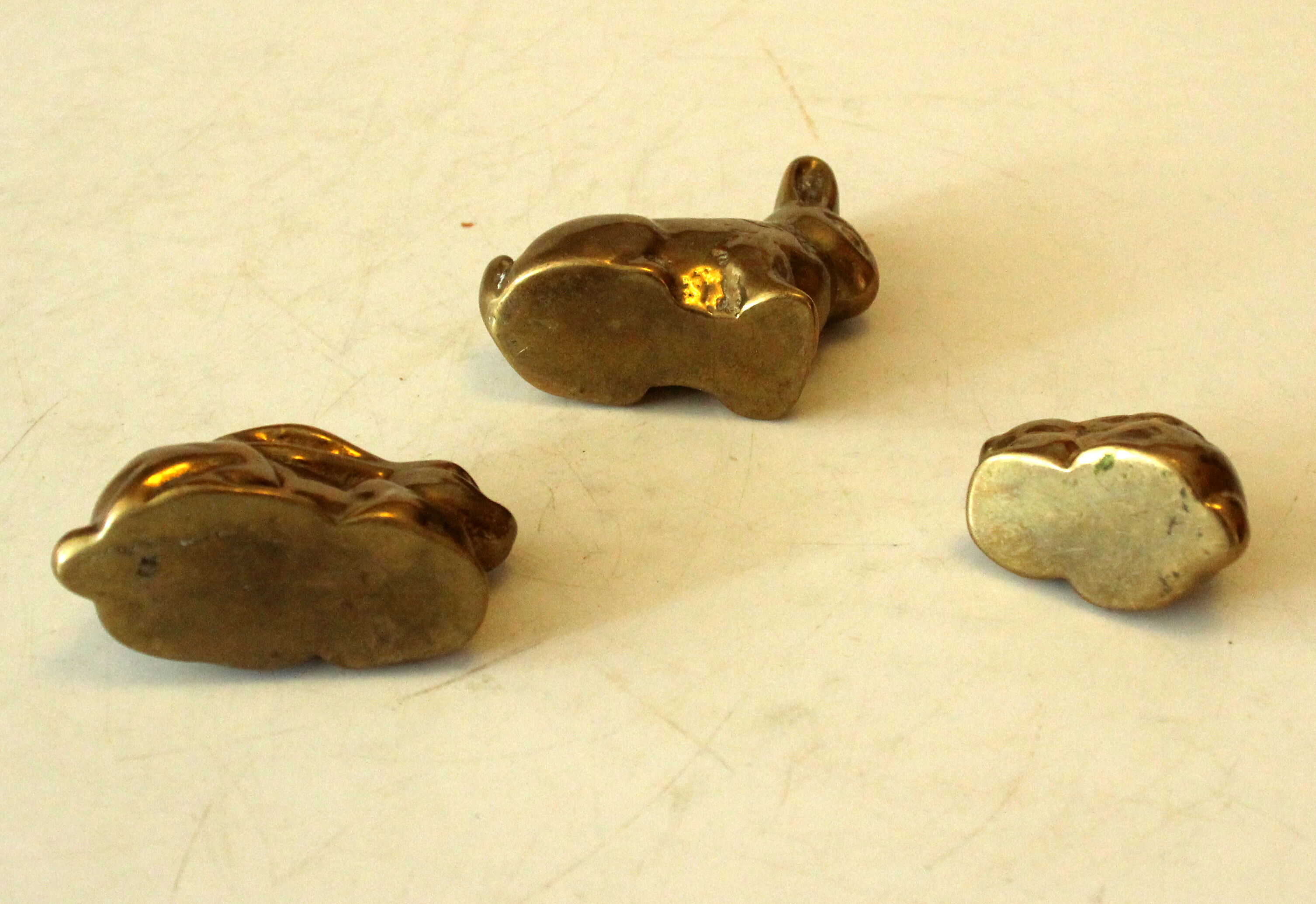 3 solid brass paperweights in the shape of rabbits vintage from the 1960s