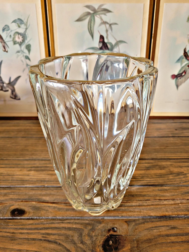 Vintage thick glass vase with twisted ribbed relief.