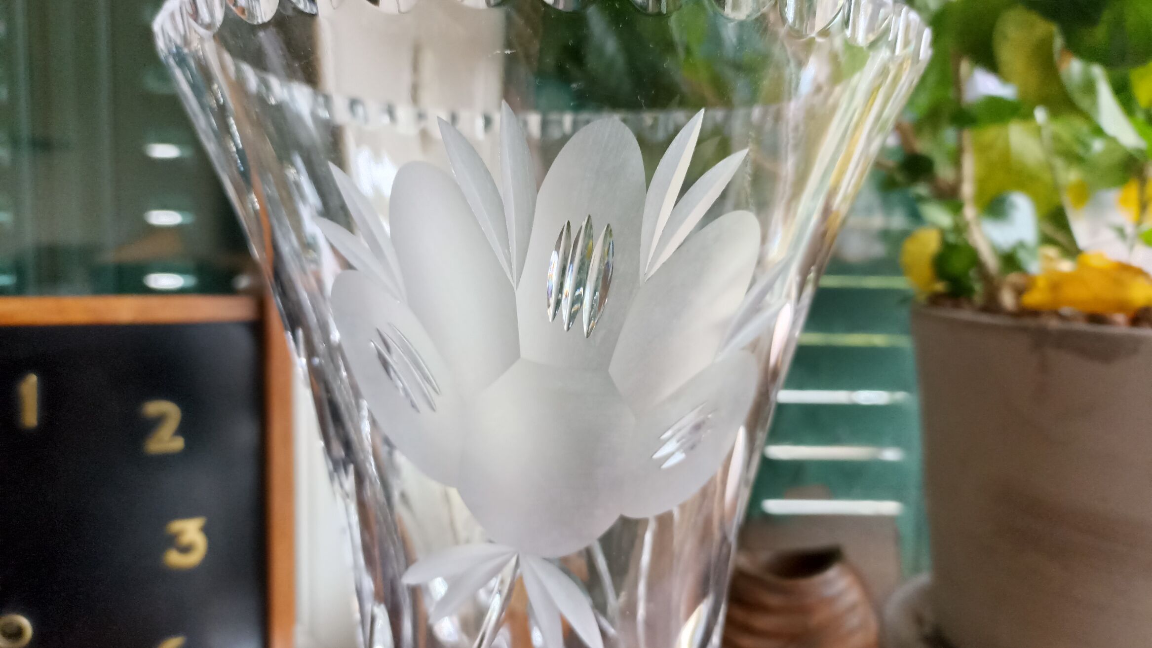 Carved solid crystal vase, floral decoration