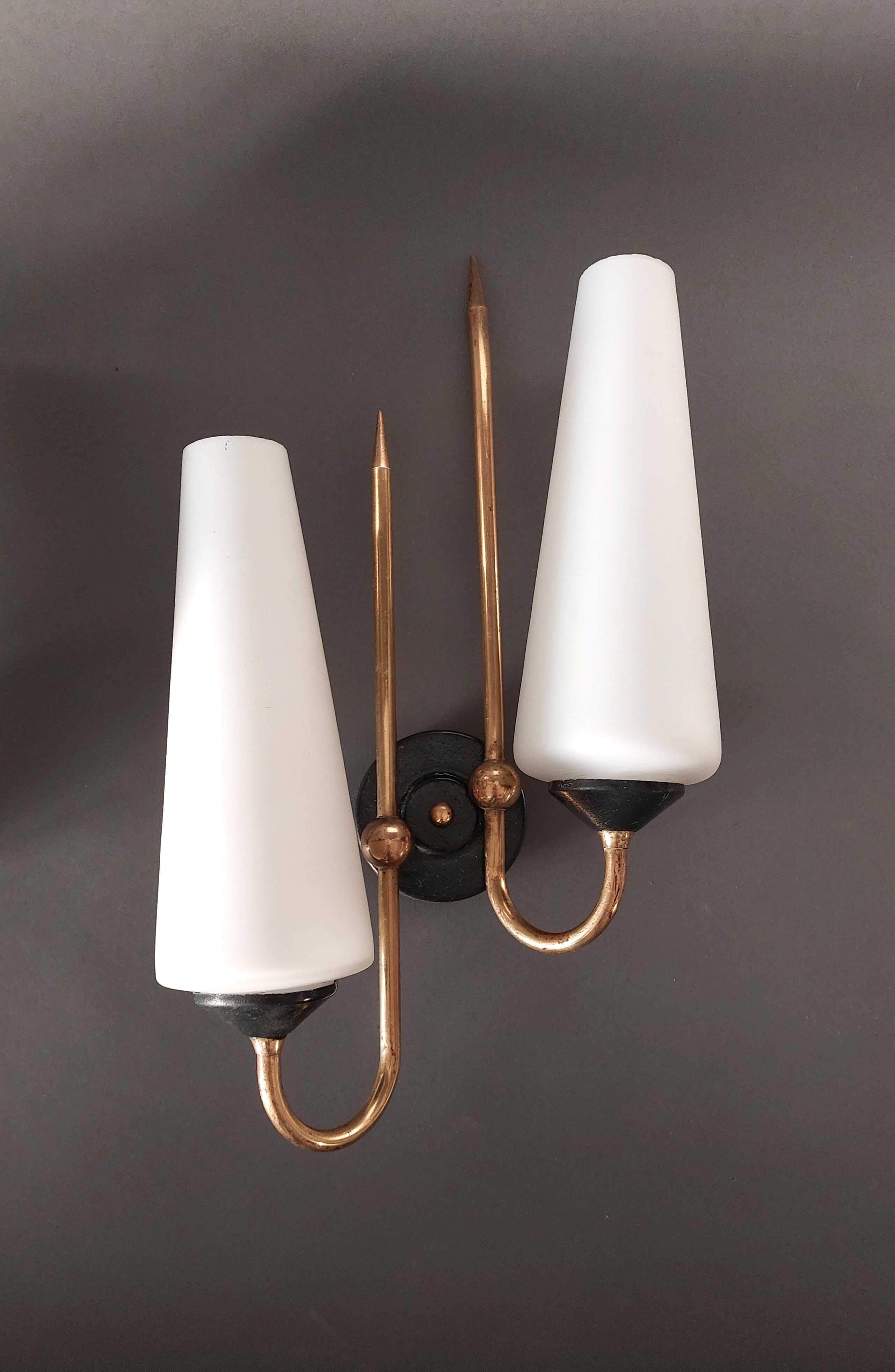 Pair of sconces in black metal and gilded brass 1960 Vintage.