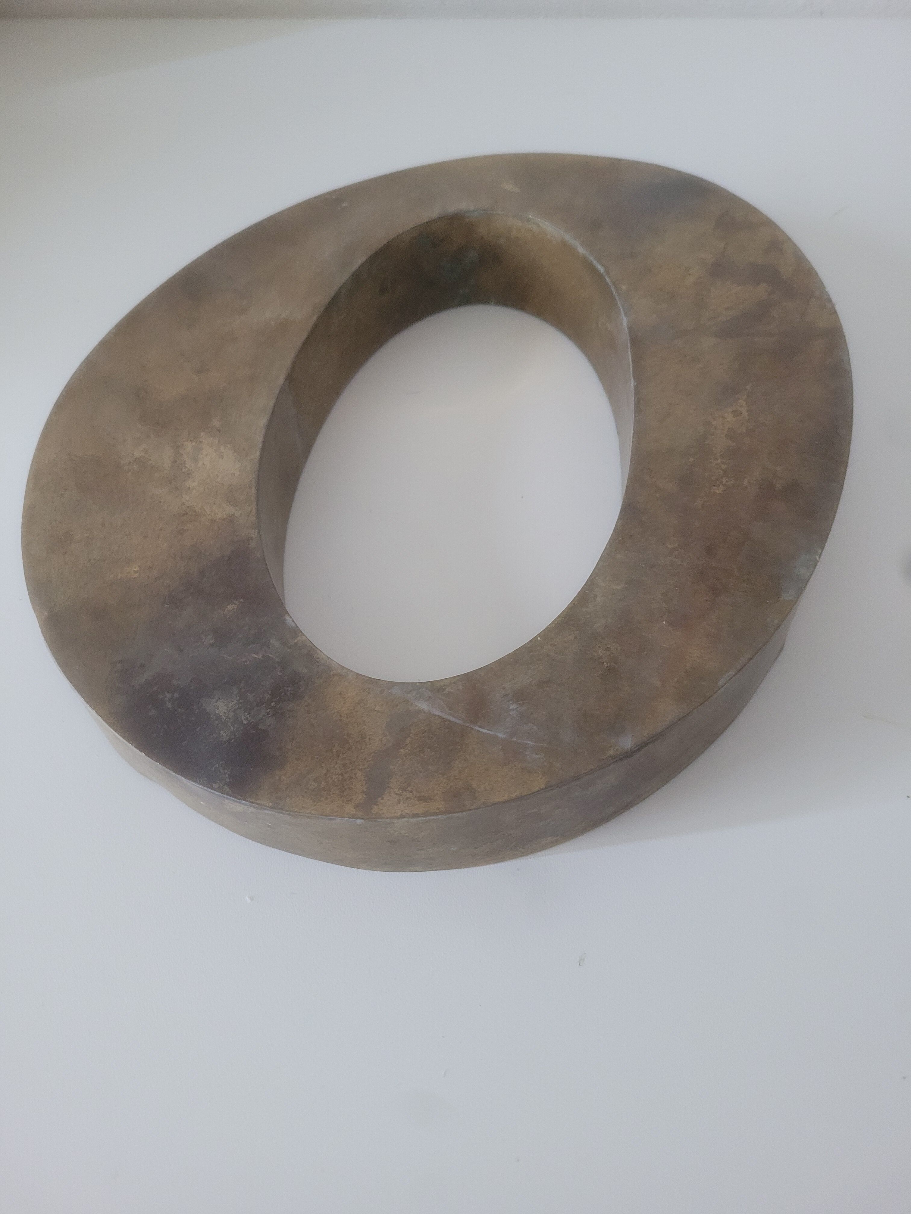 Letter O of sign in vintage gilded brass