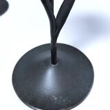 Pair of flower-shaped candlesticks in black metal and copper