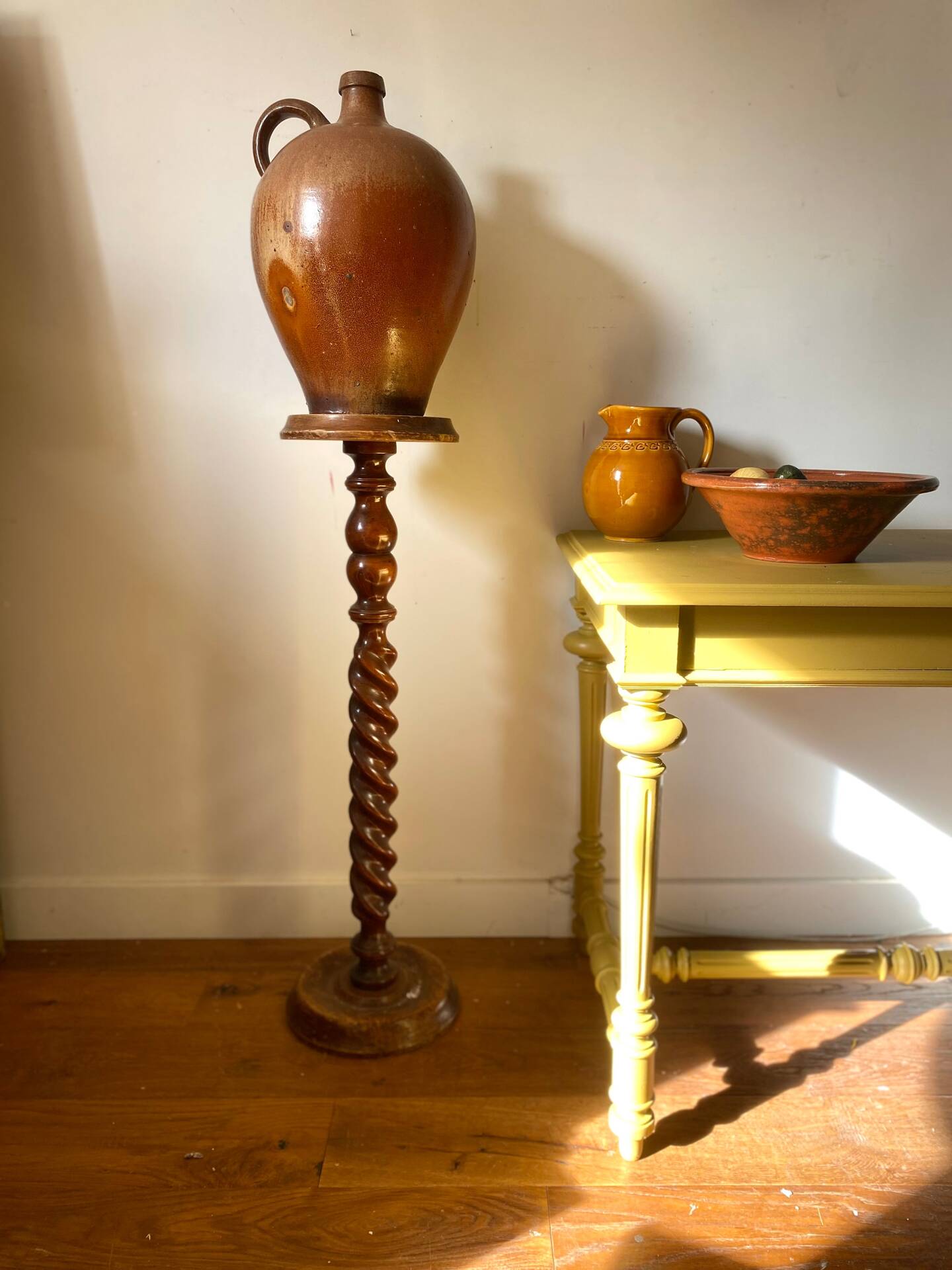 Antique pedestal table with a twisted column.