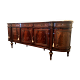 A mahogany buffet varnished with marble and bronze