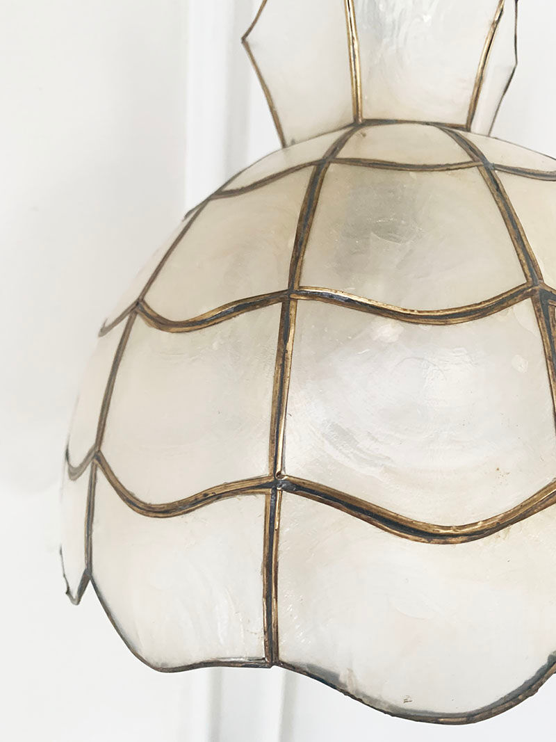 Mother-of-pearl and brass suspension