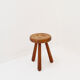 Brutalist tripod stool in solid wood, around 1960.