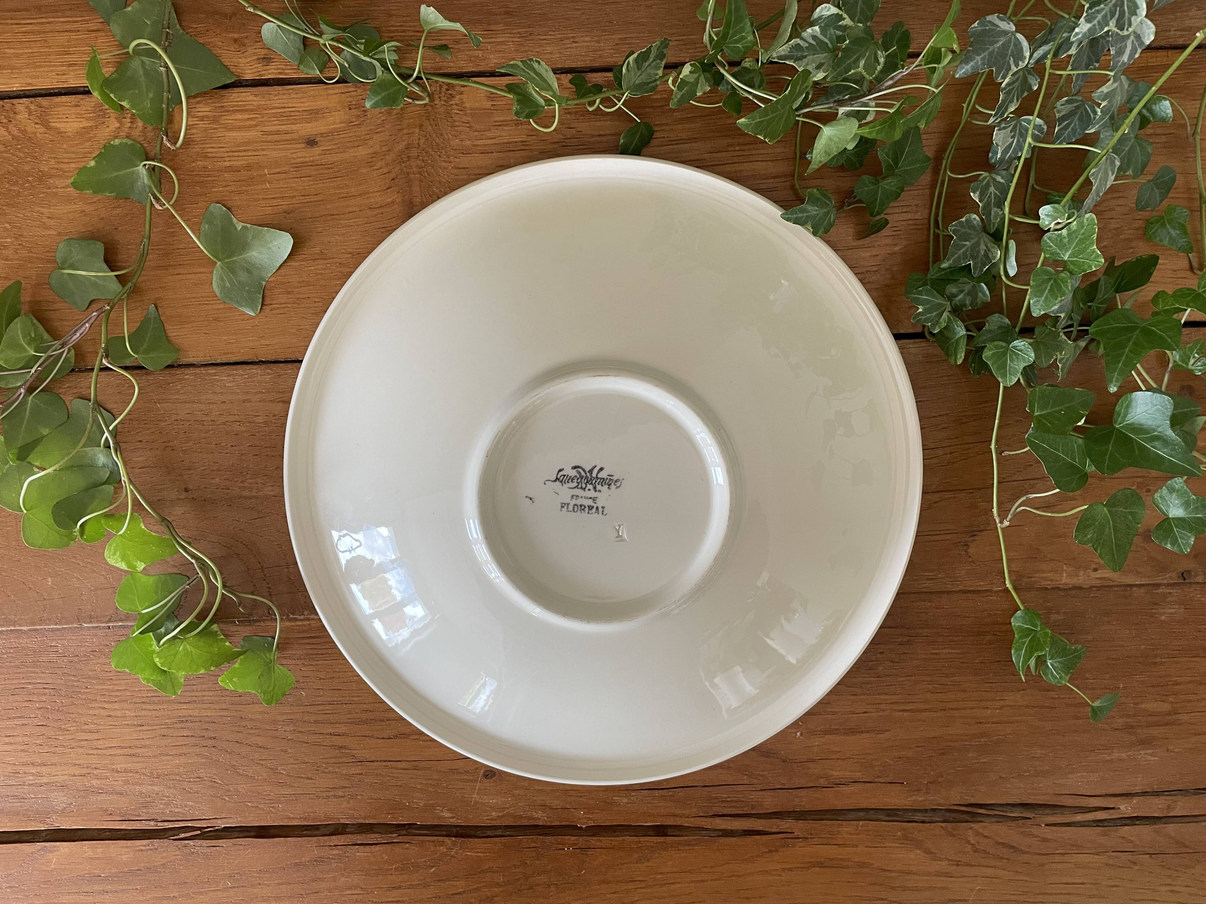 Large antique salad bowl on a pedestal, made of Sarreguemines earthenware.
