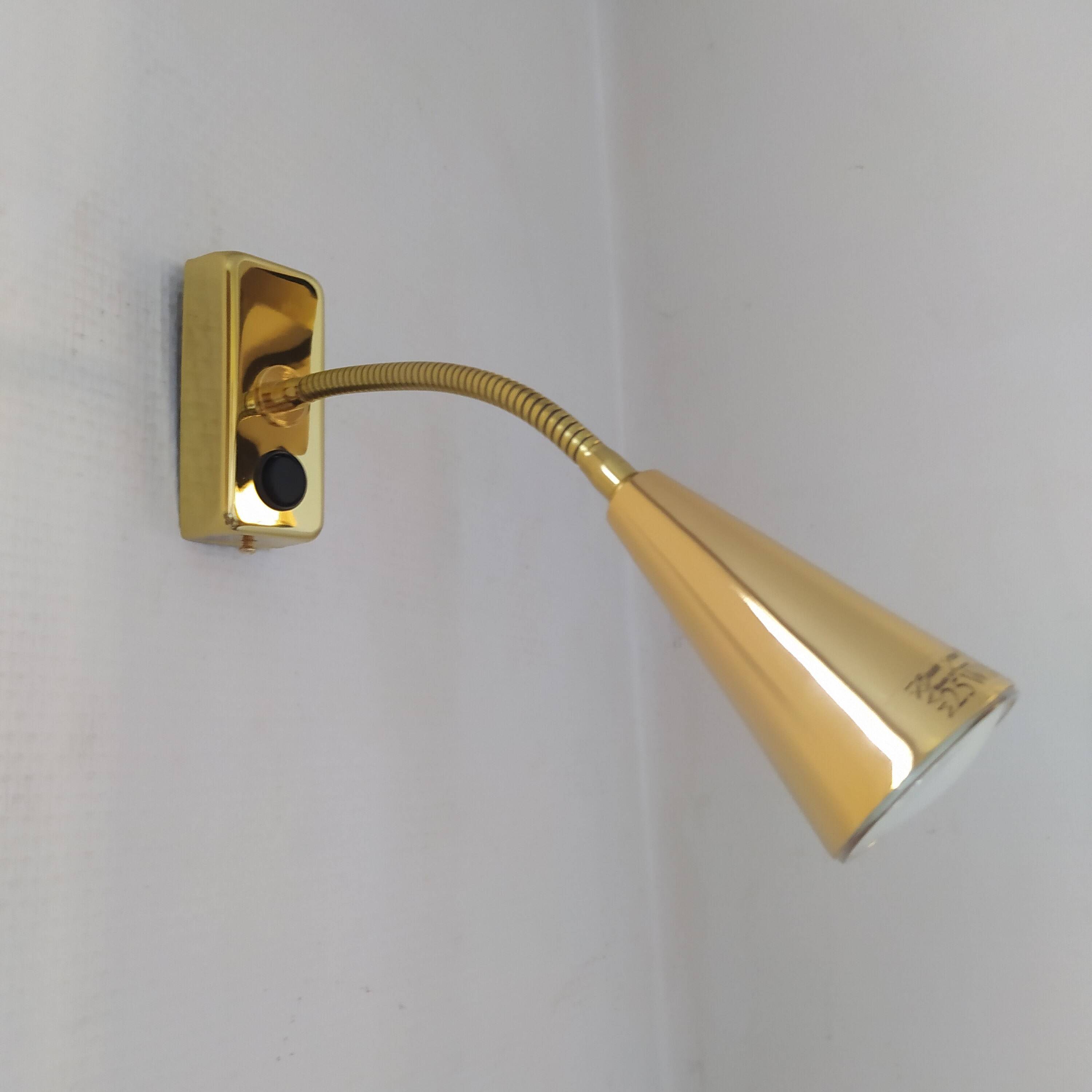 Pair of golden wall lights from the brossier saderne brand