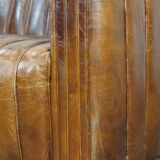 Cognac-colored cowhide 2-seater designer sofa finished with piping