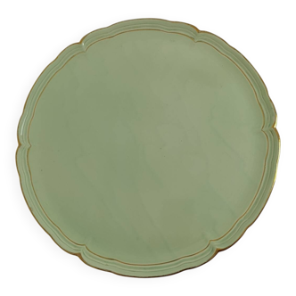 Large pastel green plate with a golden rim.