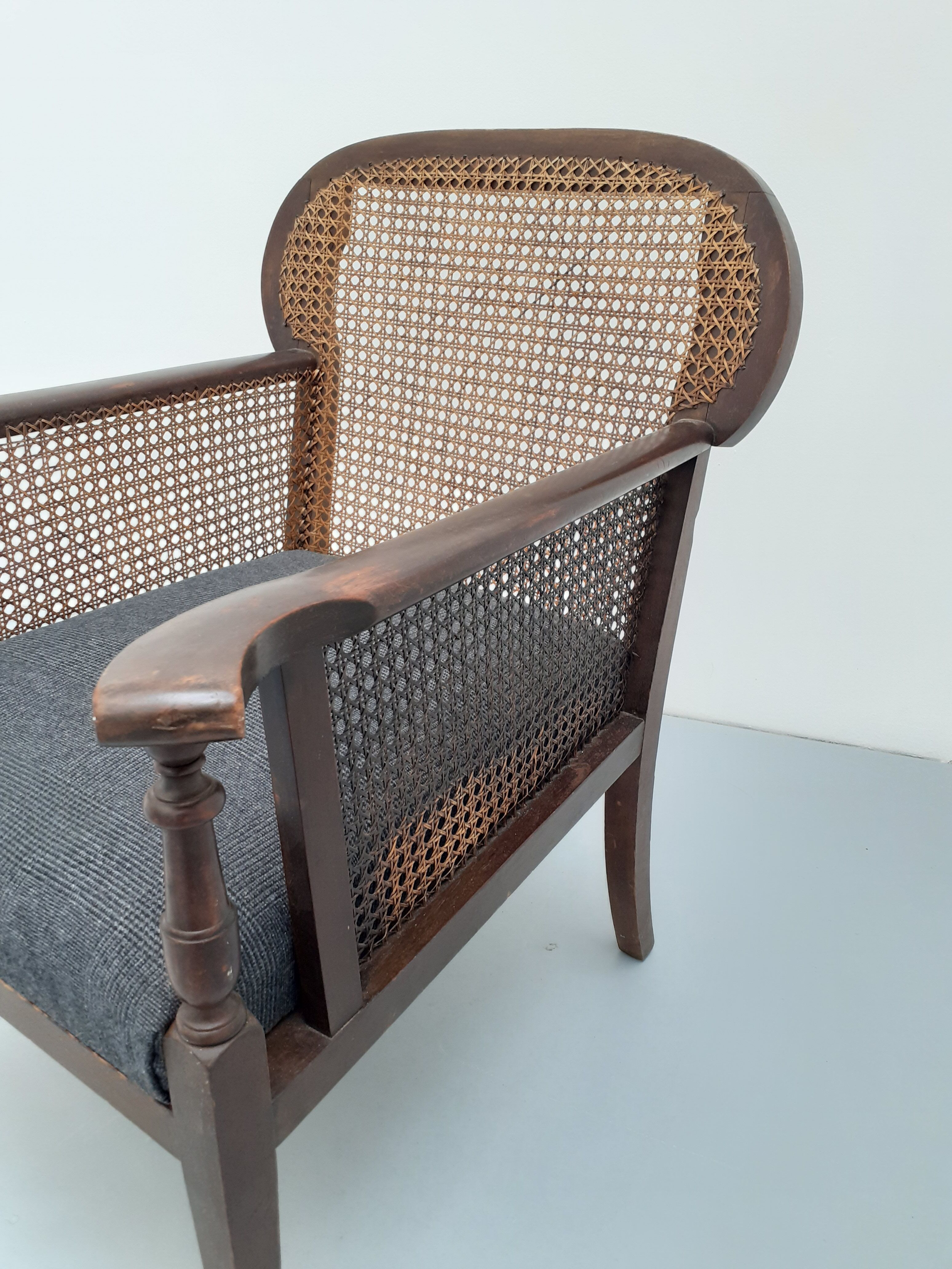 Colonial wooden armchair and cannage