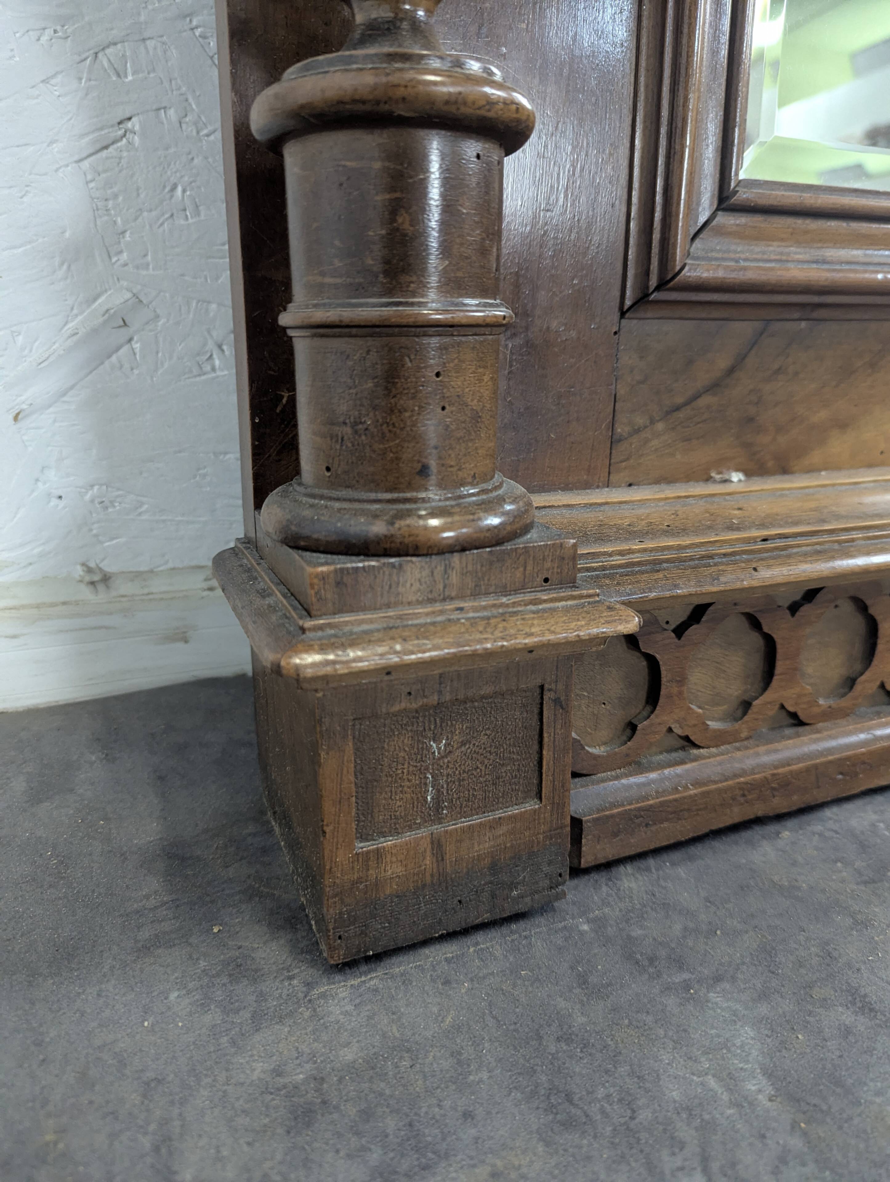 Large Renaissance-style mirror in solid walnut