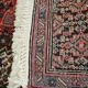 Tapis persan ancien laine tons rouge noué main