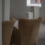 Pair of Danish Art Deco modern lounge chairs in sheepskin with lambswool and elm, 1940s.
