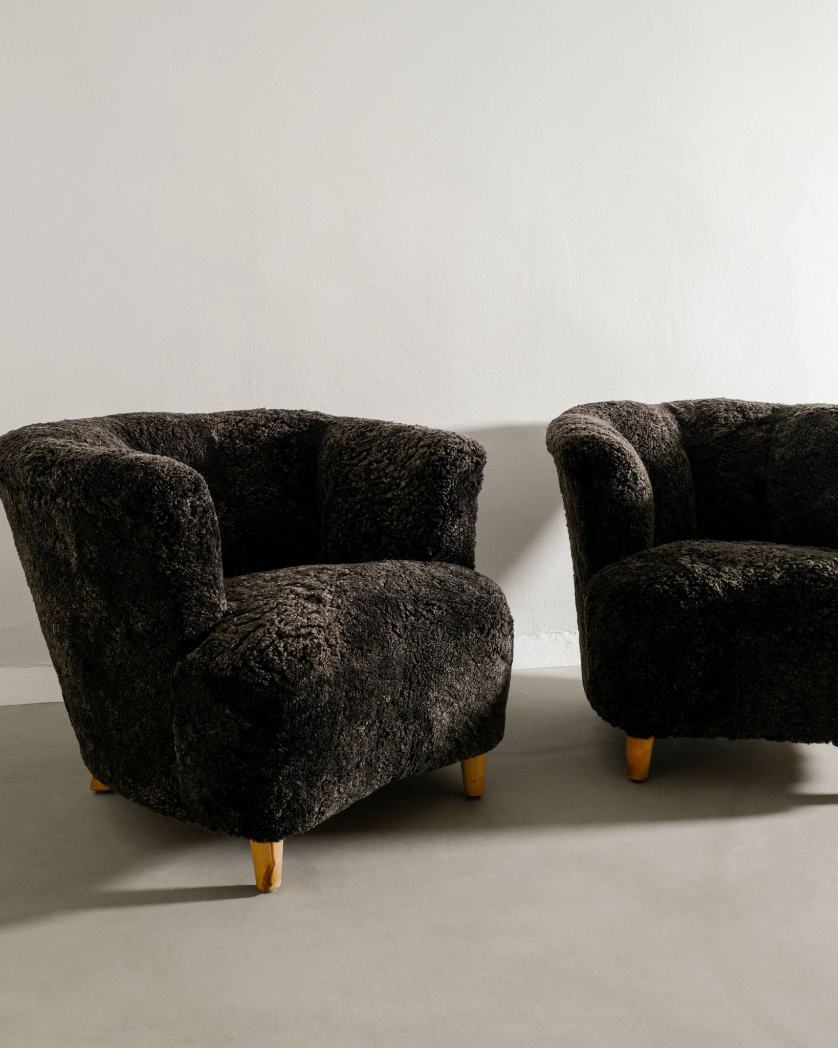 Pair of Swedish Curved Mid Century Modern Armchairs in Dark Sheepskin 1940s